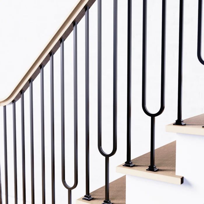 a set of stairs with black railings and handrails