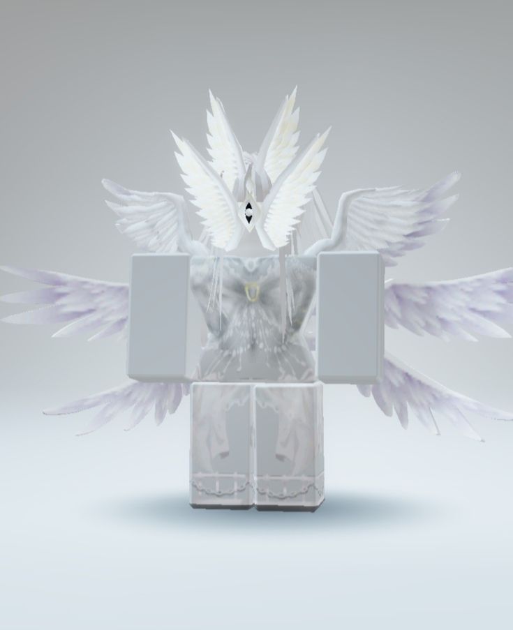 a white bird sitting on top of a box with its wings spread out and it's body in the air