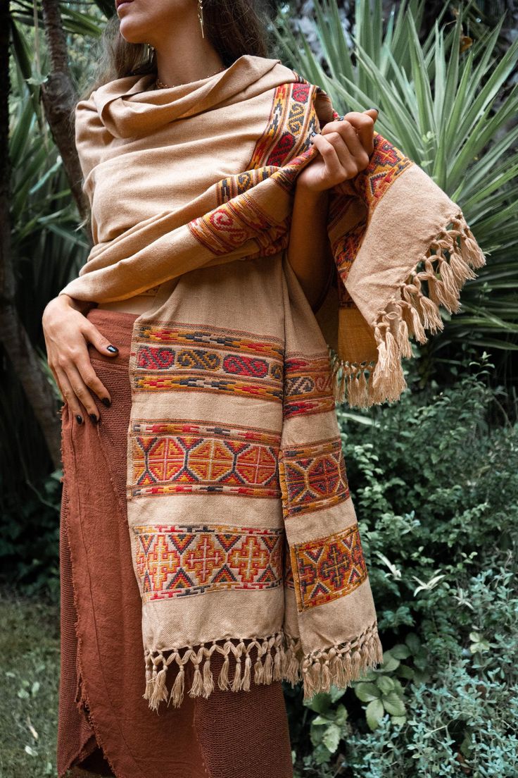 This ethnic hippie coverup/scarf is perfect to keep you warm while winter season. The dimensions are 105 x 215 cm. The embroidery process is done by hand and gives this organic tribal look.  For more similar products visit my shop : https://keralua.etsy.com ༶ ༶ ༶ ༶ ༶ ༶ ༶ ༶ ༶ ༶ ༶ ༶ ༶ ༶ ༶ ༶ ༶ ༶ ༶ ༶ ༶ ༶ ༶ ༶ ༶ ༶ ༶ ༶ ≫ MATERIAL  Mixed fibers / Wool  ༶ ༶ ༶ ༶ ༶ ༶ ༶ ༶ ༶ ༶ ༶ ༶ ༶ ༶ ༶ ༶ ༶ ༶ ༶ ༶ ༶ ༶ ༶ ༶ ༶ ༶ ༶ ༶ ≫ FITTING / CARE  Our product is presented in one size and the dimension is 105 x 215 cm Our orga Bohemian Embroidered Summer Shawl, Bohemian Beige Handwoven Shawl, Beige Handwoven Bohemian Shawl, Bohemian Brown Scarves For The Beach, Bohemian Brown Scarves For Beach, Bohemian Brown Scarf For The Beach, Bohemian Brown Scarf For Beach, Bohemian Multicolor Festival Dupatta, Bohemian Beige Shawl For Festivals