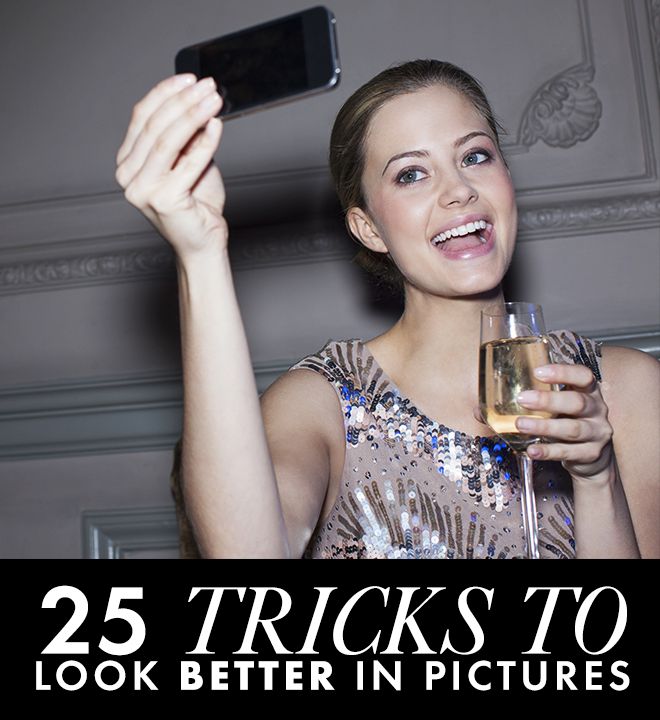 a woman taking a selfie with her cell phone while holding a glass of wine