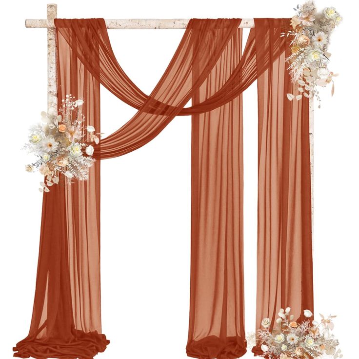 an orange curtain with flowers on it and two white flowers hanging from the side, in front of a white background