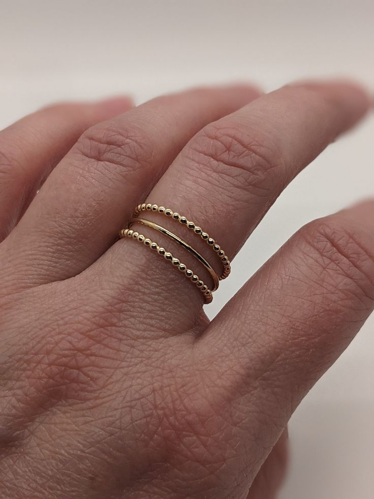 Beaded 14k gold filled ring.  This ring is perfect for everyday wear and a great stacking ring. Classic 14k Gold Filled Stackable Rings, Dainty Stackable Jewelry, Dainty Inelastic Stackable Jewelry, Elegant Adjustable Stackable Rings In 14k Gold Filled, Classic Stackable 14k Gold Filled Midi Rings, Dainty Hypoallergenic Rings With Round Beads, Dainty Hypoallergenic Beaded Rings, Classic Adjustable Stackable 14k Gold-filled Rings, Classic Adjustable Stackable 14k Gold Filled Rings