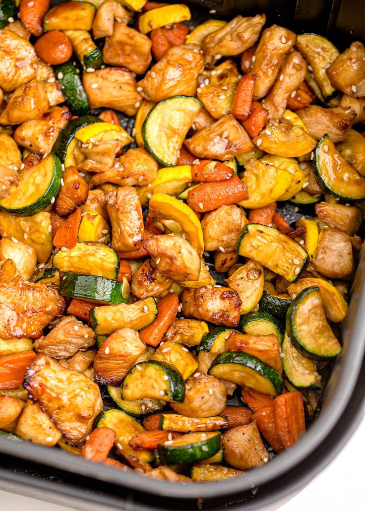 chicken and zucchini stir fry in a pan