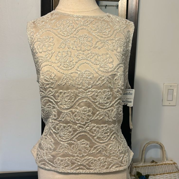 This Is A Beautiful Vintage 80s Evening Piece. The Beads Are Intact. Dead Stock. New With Tags. From Loehmanns!! It Is Lined And Is A Heavy Weight Piece. Perfect For Under A Sweater Or Blazer Or Worn Alone. Size 14. Measurements Flat Pit To Pit 20” Waist 17” Length 21” Sleeves 10” Glamorous Fitted Tank Vest, Elegant Evening Tank Vest, Fitted Embellished Vest, Embellished Sleeveless Top For Evening, Sleeveless Embellished Top For Evening, Elegant Sequined Sleeveless Tank Top, Embellished Sleeveless Evening Vest, Embellished Fitted Sleeveless Tank Top, Evening Embellished Sleeveless Vest