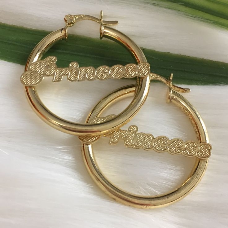 Princess Nameplate Round Hoop Earrings In 14k Authentic Brazilian Gold Filled. Rustic In The Middle. Hypoallergenic, Does Not Tarnish And Great For Sensitive Skin. High Quality. Can Be Use Everyday Or As A Gift For Someone Special. Brand New. Approx Measurements: Diameter Is A Little Bit More Than 1-1/4’ Width 1-1/4’ Lightweight. Feel Free To Ask Any Questions Elegant Personalized Hoop Jewelry, Personalized Elegant Hoop Jewelry, Gold Hoop Earrings With Custom Name, Gold Custom Name Hoop Earrings, Elegant Personalized Huggie Earrings, Personalized Elegant Huggie Earrings, Custom Name Hoop Earrings For Anniversary, Personalized Small Hoop Jewelry For Anniversary, Personalized Gold Huggie Jewelry