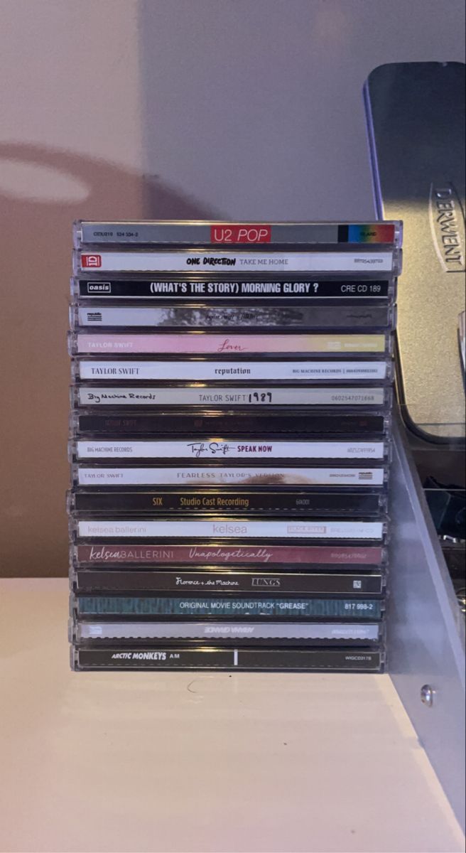 a stack of cds sitting on top of a table