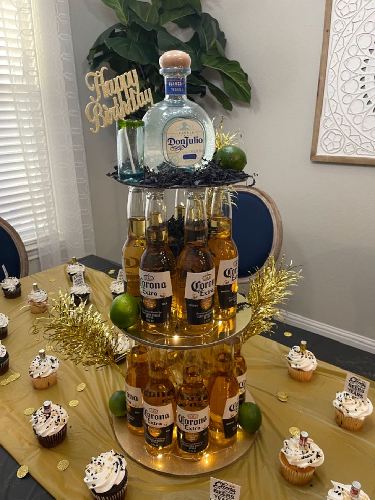 cupcakes and bottles of alcohol on a table