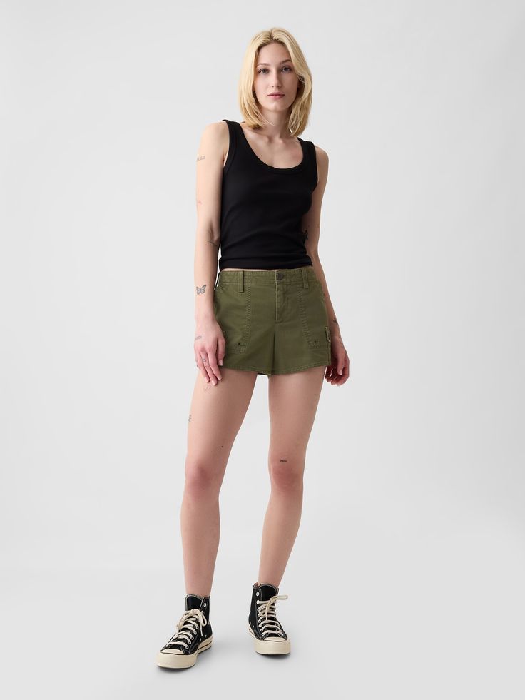 Soft cotton twill shorts.  Button closure, zip fly.  Front slant pockets, back patch pockets.  Mini cargo pockets at sides.  This short is made with 100% regenerative cotton, which is grown using holistic agricultural practices that improve soil health, climate resilience, water retention, and local biodiversity.  * Fit: Relaxed.  An easy silhouette throughout.  Hits above the knee.  Inseam: 3" 8 cm) Model is approx.  5’10” wearing Green Denim Shorts Outfit, Green Shorts Outfit, Y2k Cargo Shorts, Low Rise Y2k, Easy Silhouette, Outfit Grunge, Denim Shorts Outfit, Agricultural Practices, Water Retention