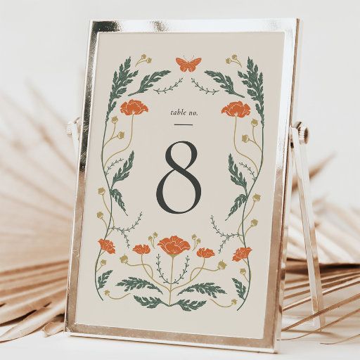 the table number is displayed in an ornate frame