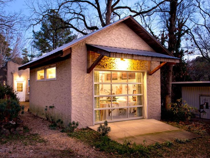 a small house with a lit up front door