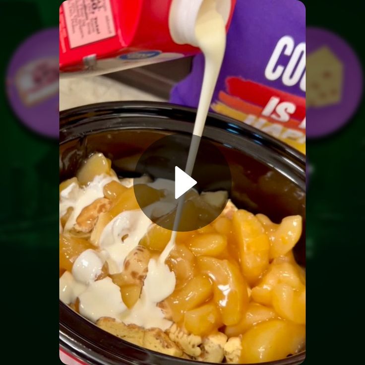 a crock pot filled with macaroni and cheese being poured into the slow cooker