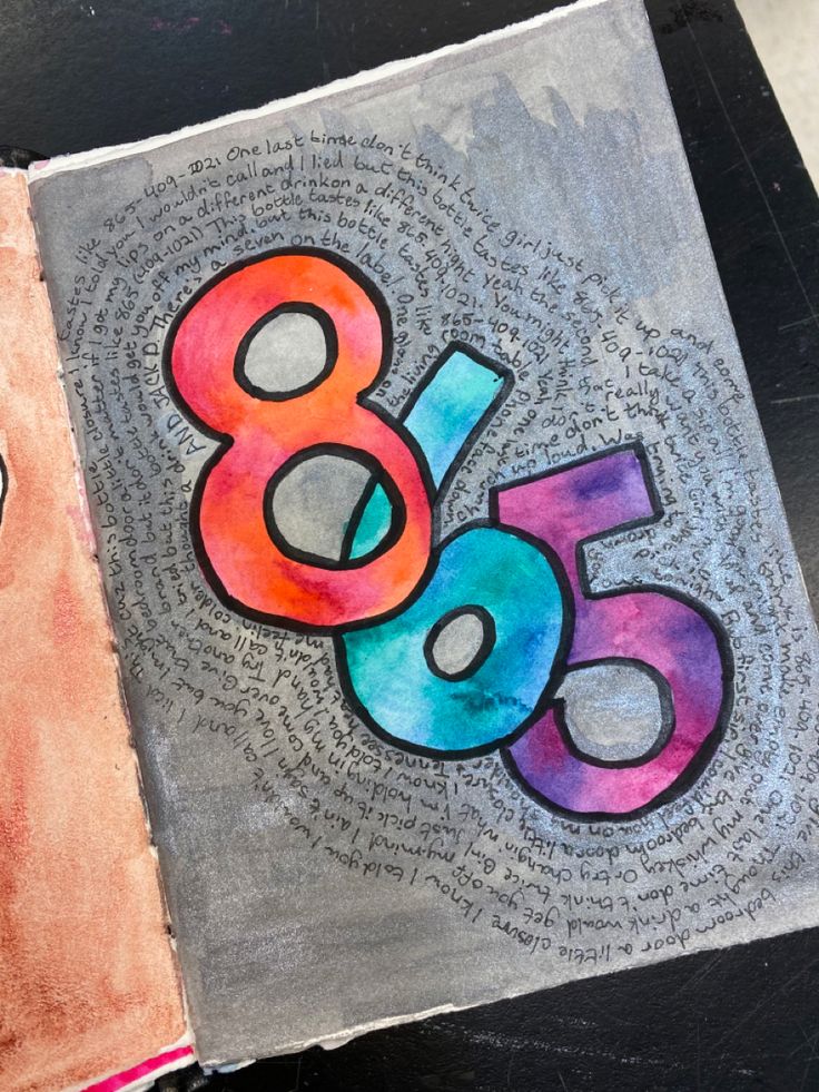 an open book with the number thirty five written in colorful ink on top of it