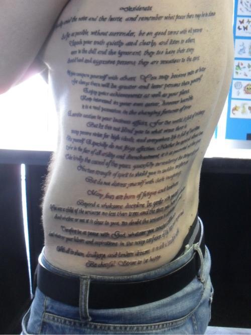 the back of a man's body with writing on it