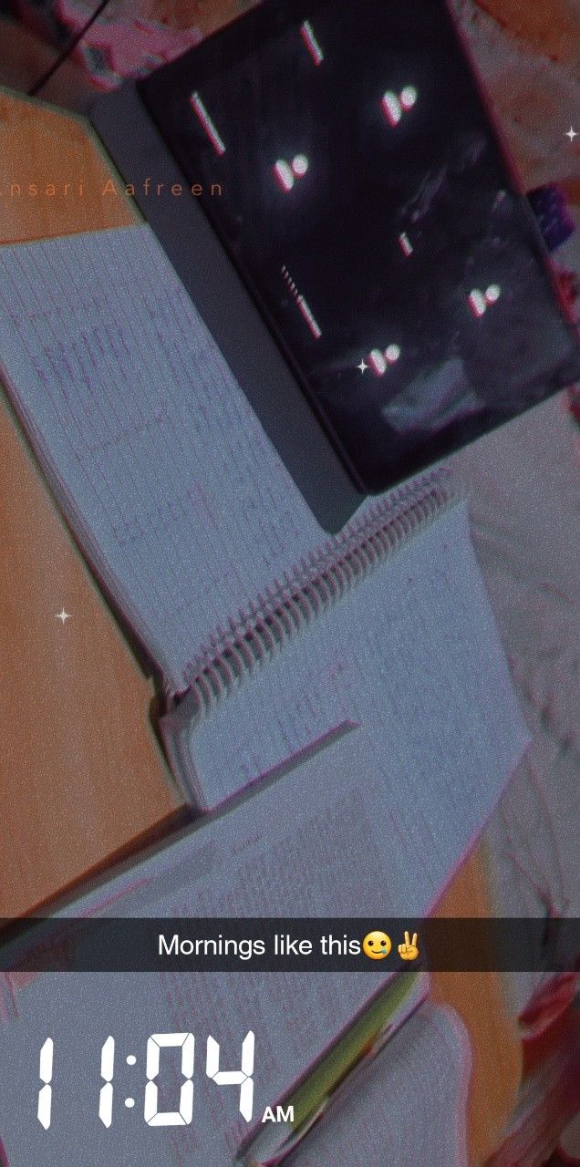 an open book sitting on top of a wooden table