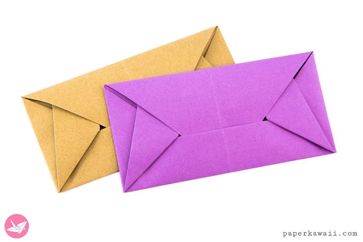 two origami envelopes sitting next to each other on a white background photo