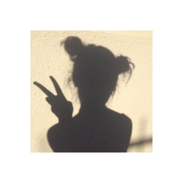 the shadow of a woman's head and hand is shown on her instagram