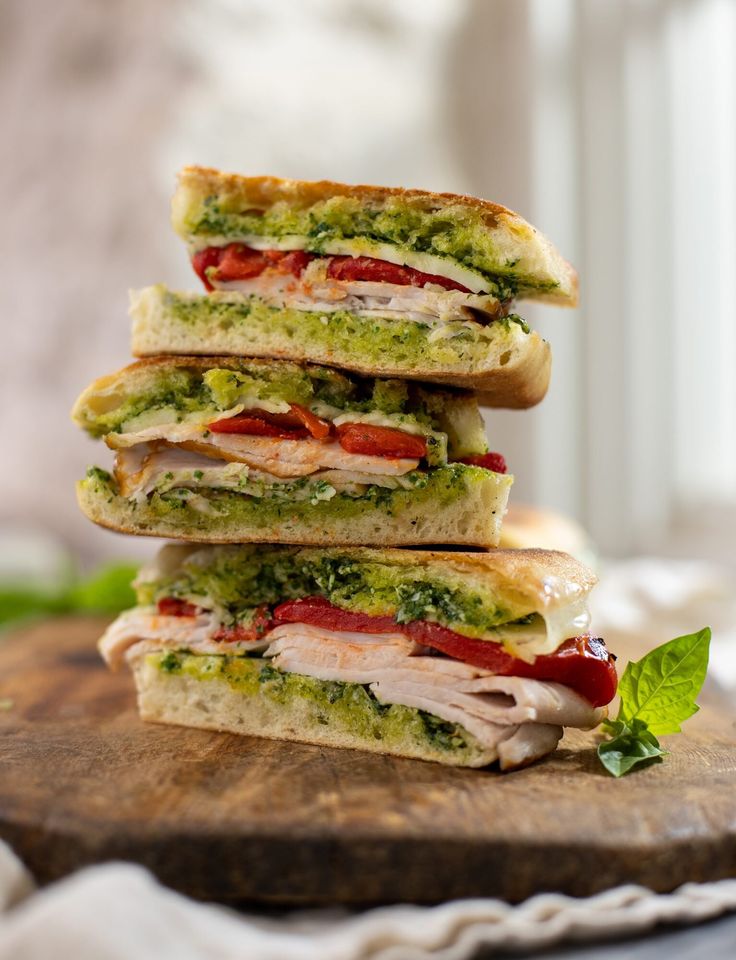 four sandwiches stacked on top of each other