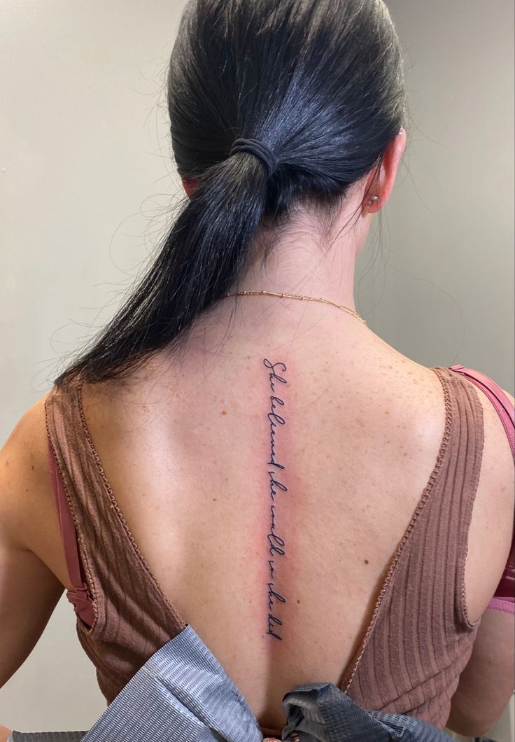 a woman with a tattoo on her back