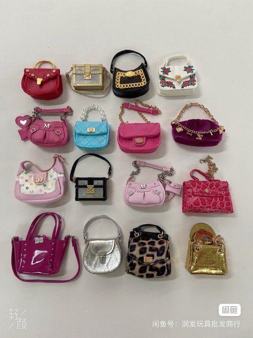 a bunch of purses are arranged on a white surface with chinese characters in the background