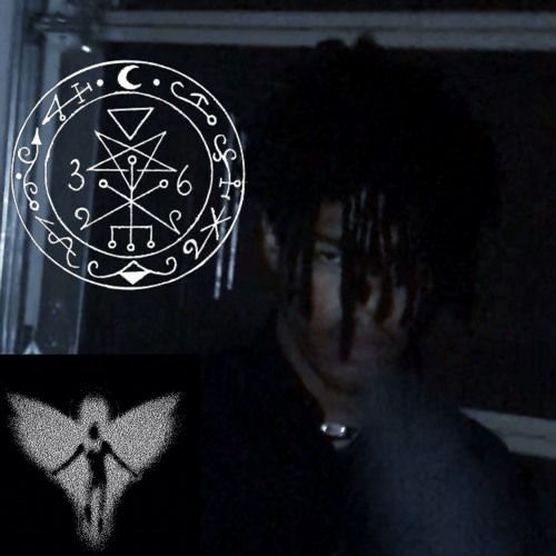 an image of a man with a pentagramil on his face in the dark