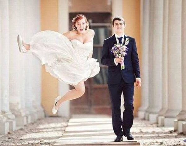 a man and woman dressed in formal wear are posing for the camera