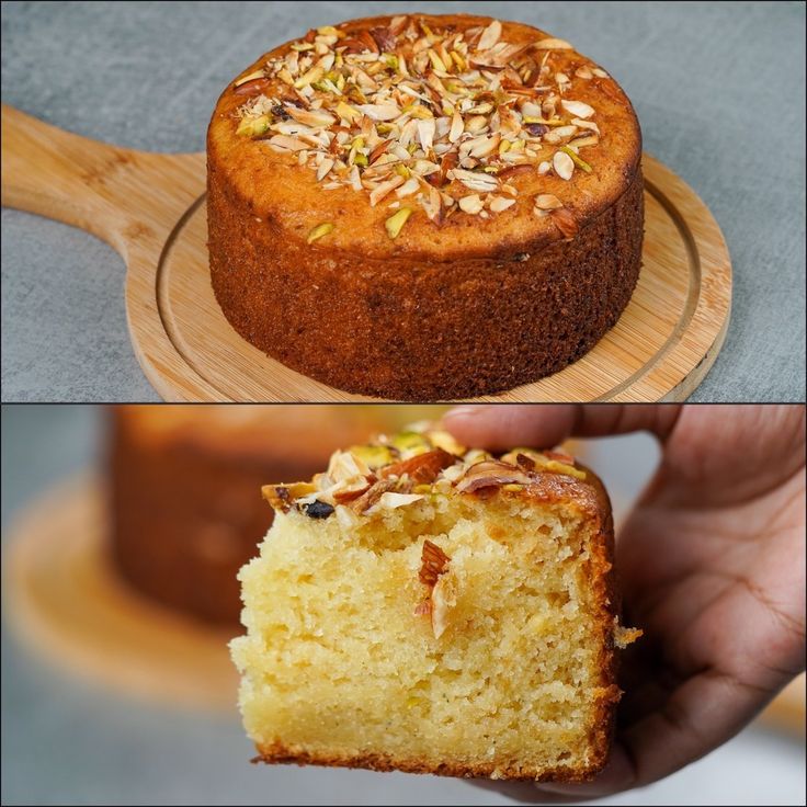 there is a cake with nuts on top and in the middle, it has a slice taken out