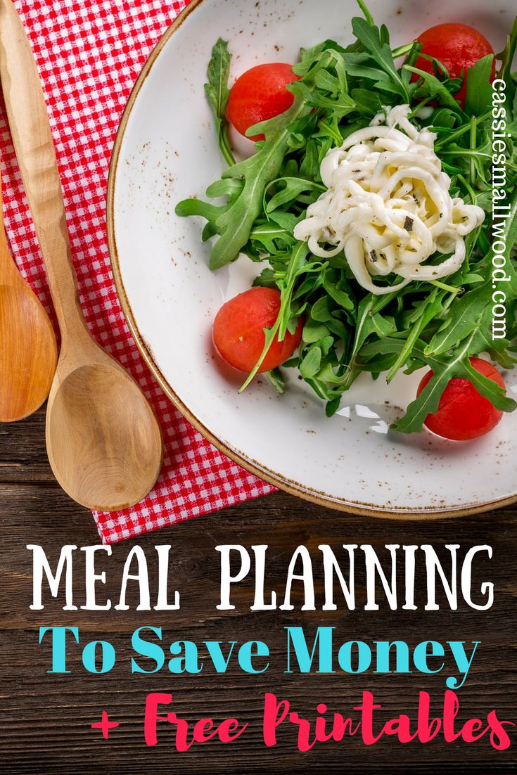 a white plate topped with salad on top of a wooden table