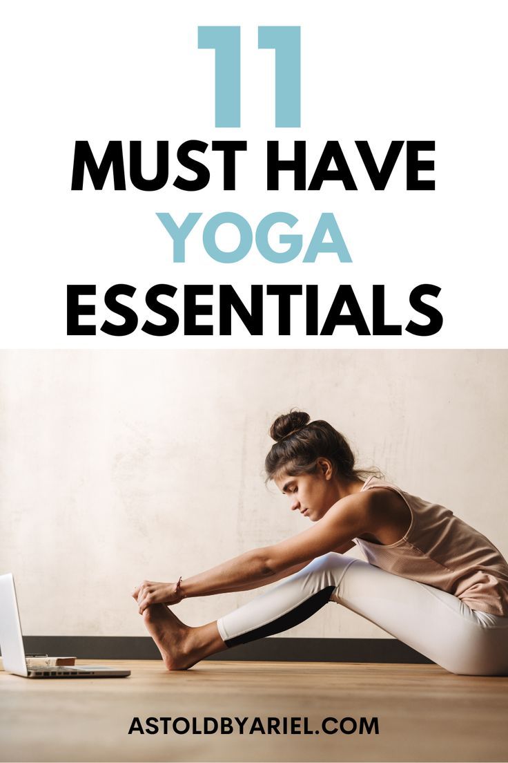 a woman doing yoga on her laptop with the title 11 must have yoga essentials