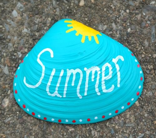 a painted rock with the word summer written on it