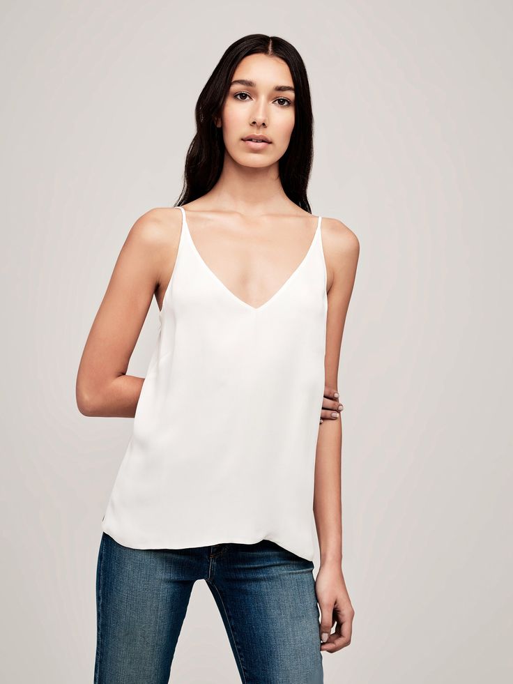 A slinky, 100% silk camisole in soft ivory. Sharp v-neckline, adjustable spaghetti straps, and darted cups streamline the silhouette, and make for the perfect layering piece. Silk V-neck Tank Top With Adjustable Straps, Chic V-neck Camisole With Straps, Chic V-neck Tank Top With Adjustable Straps, Chic V-neck Top With Straps, Feminine Silk V-neck Tank Top, Feminine V-neck Top With Adjustable Straps, White V-neck Tank Top With Delicate Straps, Chic V-neck Tank Top With Delicate Straps, White V-neck Camisole With Delicate Straps