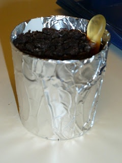 a piece of tin foil with a spoon in it