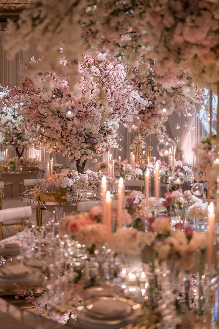 an elegant wedding reception with flowers and candles