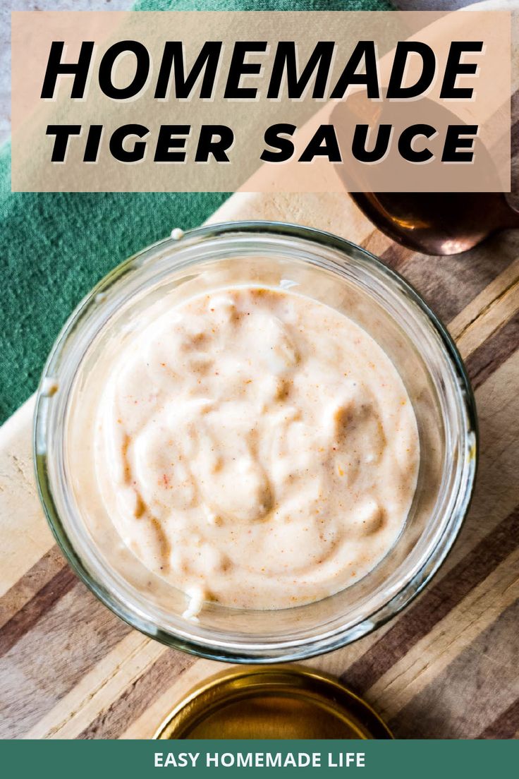 homemade tiger sauce in a glass bowl on top of a wooden cutting board with text overlay