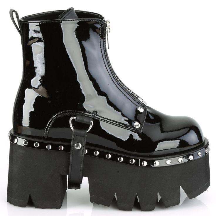 a pair of black boots with spikes on them