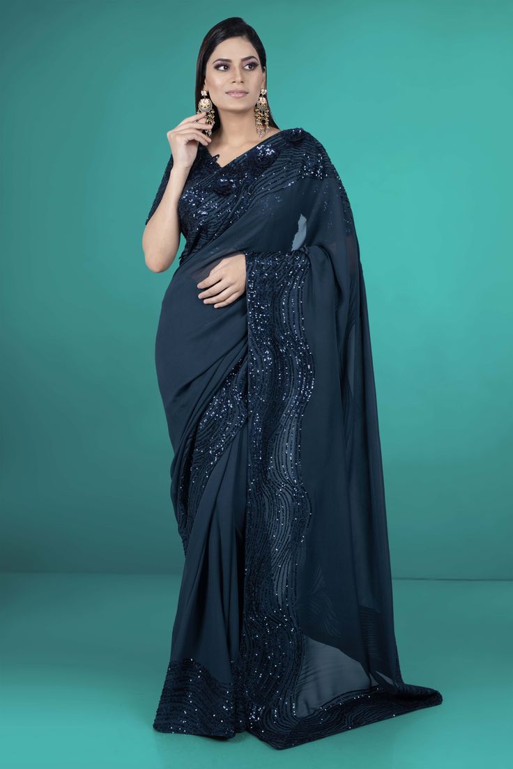 Get ready to shine in our Party Wear Saree D-207! With beautiful sequence work, you'll stand out in any crowd. Make a statement and dazzle in this unique and playful saree. (Go ahead, show off!) Extra fabric inside the blouse Waist is stretchable Pre-draped Saree With Dupatta For Navratri Party, Party Pre-draped Chinon Saree With Mirror Work, Traditional Evening Saree In Chinon, Bollywood Georgette Pre-draped Saree For Party, Evening Georgette Saree With Zari Work, Evening Georgette Saree With Mirror Work, Party Wear Chinon Dupatta For Evening, Evening Party Wear Chinon Saree, Eid Party Wear Pre-draped Dola Silk Saree