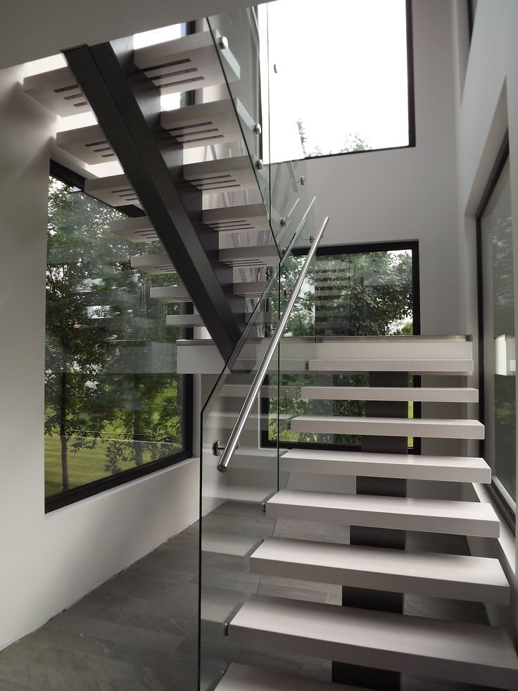 the stairs are made of glass and steel