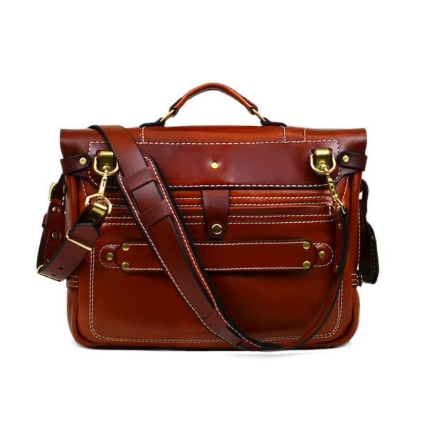 Heirloom Messenger-2 Brown Saddle Bag With Leather Lining For Work, Brown Leather-lined Saddle Bag For Work, Workwear Brown Saddle Bag With Leather Lining, Cognac Leather Saddle Bag For Work, Leather Saddle Bag For Work, Brown Leather-backed Laptop Bag For Work, Brown Leather Saddle Bag With Palladium Hardware, Brown Briefcase With Palladium Hardware For Work, Workwear Leather Saddle Bag With Leather Lining