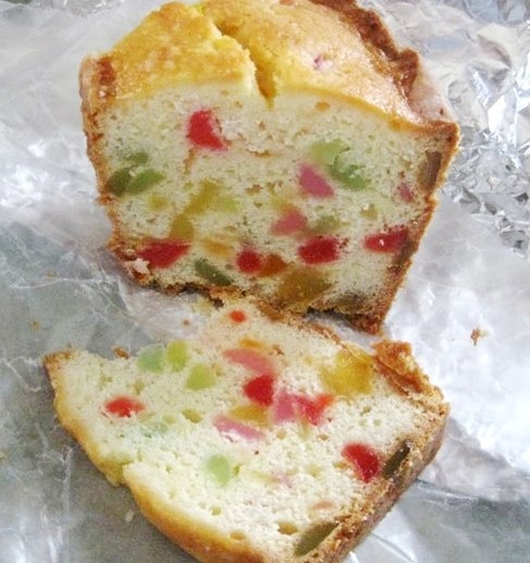 two pieces of cake sitting on top of aluminum foil