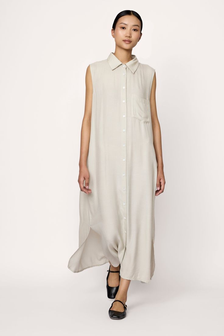 Effortless yet refined, our sleeveless shirt dress is perfect for everyday wear. Crafted from Japanese moss crepe, it offers a relaxed fit with an elevated finish. This versatile piece features a playful pocket, optional belt and inseam pockets for convenience. A truly timeless design. Made with 100% Japanese moss crepeHandmade in IndiaMachine wash cold, lay flat to dry, warm iron as needed. Honoring Earth + Maker Our wovens are handcrafted in India, preserving age-old textile traditions. Made i Sustainable Knitwear, Organic Dress, Sleeveless Shirt Dress, Dresses Spring, Dress Linen, Handmade Clothing, Flowy Maxi Dress, Sleeveless Shirt, New Arrival Dress