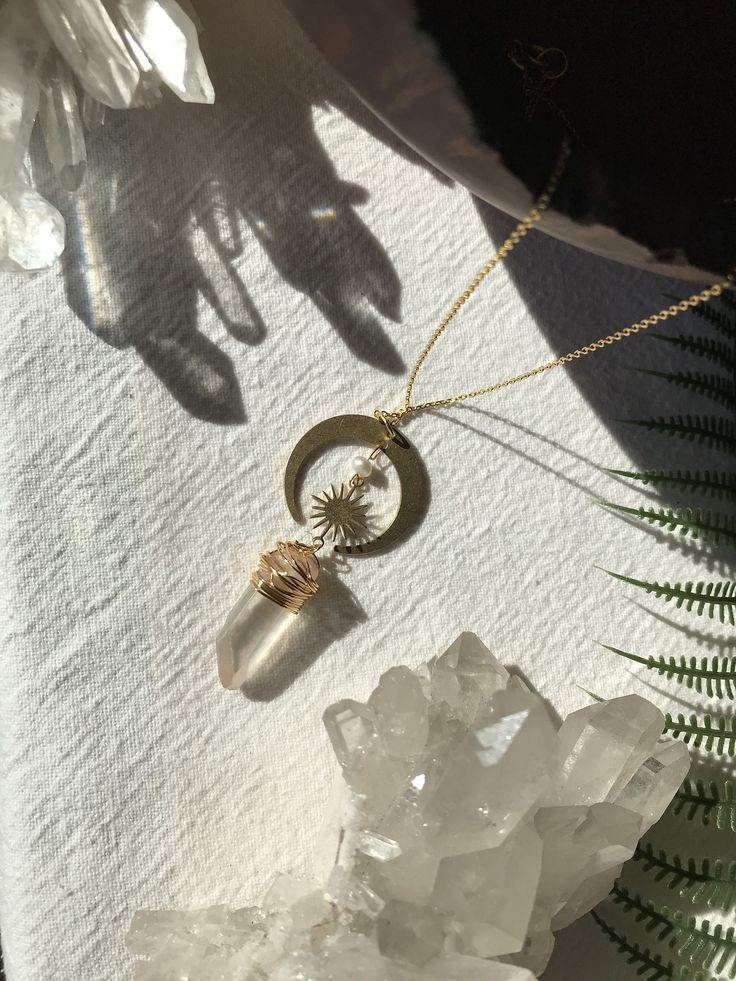 🌜Handmade Celestial Aurora Quartz Necklace🌛 ✨Made with love and intention✨ Hypoallergenic 18k gold plated sterling silver. Handmade with love and intention. FOLLOW: Insta: @alchemistreasure ✨P R O D U C T I O N - T I M E ✨ Each one of my lovingly handcrafted creations is naturally one of a kind and hand made to order. Please allow 2-4 business days for production. If you have a specific deadline, please let me know and I will do my best to accommodate you! ✨N A T U R A L - V A R I A T I O N ✨ Luxury Spiritual Clear Jewelry, Celestial Moon-shaped Jewelry For Meditation, Celestial Moon Jewelry For Meditation, Spiritual Moon-shaped Everyday Jewelry, Spiritual Moon Charm Jewelry For Everyday, Gold Crystal Healing Necklaces 14k Gold Filled, Ethereal Necklace With Moon Charm For Gifting, Spiritual Jewelry With Moon Charm For Everyday, Everyday Spiritual Moon Charm Jewelry