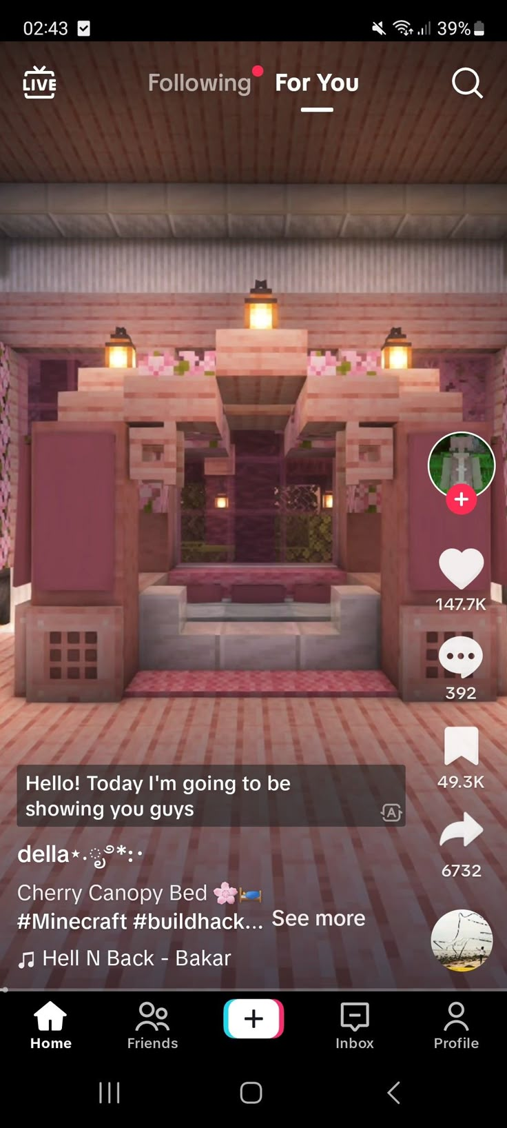 a room with pink walls and white floors is shown on the phone screen, which displays an image of a living area