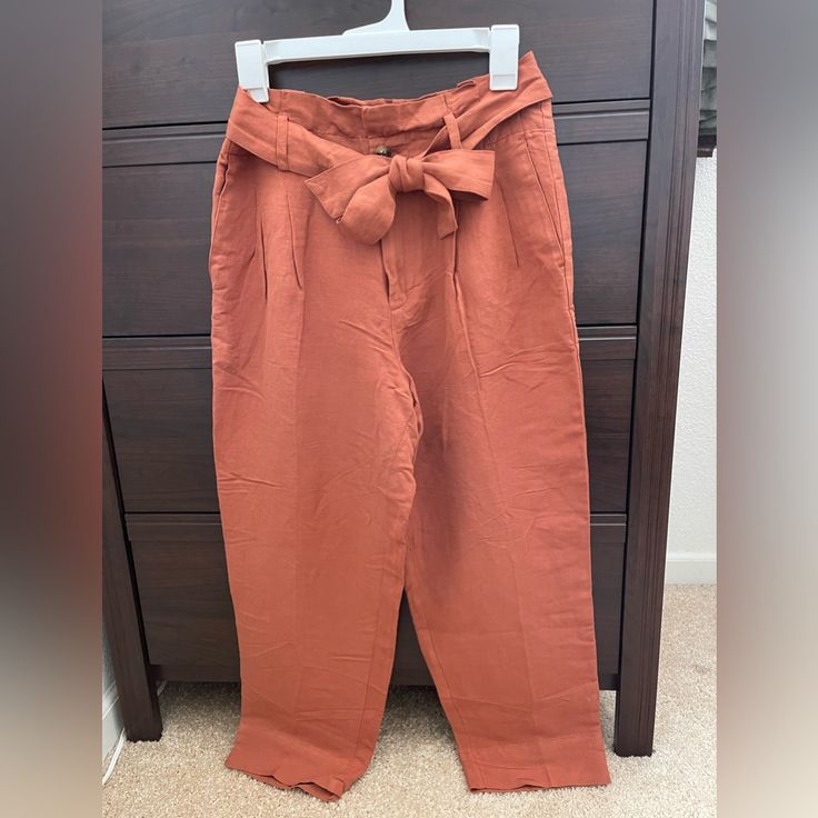 Perfect For Spring, Summer Or Fall! These Stylish Paper Bag Pants Can Be Dressed Up Or Down: For Casual Dinner Date Or Business Casual Work Meeting. -55% Linen -45% Viscose -Burnt Orange/Brown Fabric -Removable Waist Band -Ykk Front Zipper -Come With Spare Button Brown Paperbag Waist Pants With Pockets, Casual Brown Paperbag Waist Pants, Orange Workwear Bottoms With Pockets, Orange Workwear Pants With Pockets, Orange Pants With Pockets For Day Out, Orange Ankle-length Pants With Pockets, Madewell Jumpsuit, Paper Bag Pants, Bag Pants