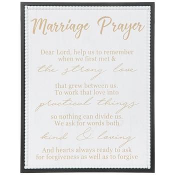 a wedding prayer card with gold lettering