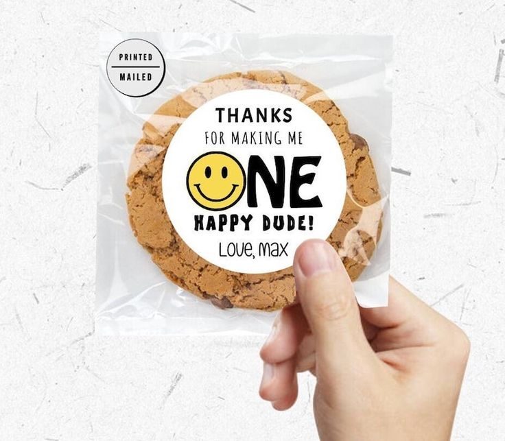 a hand holding a cookie with the words thank you for making me happy now