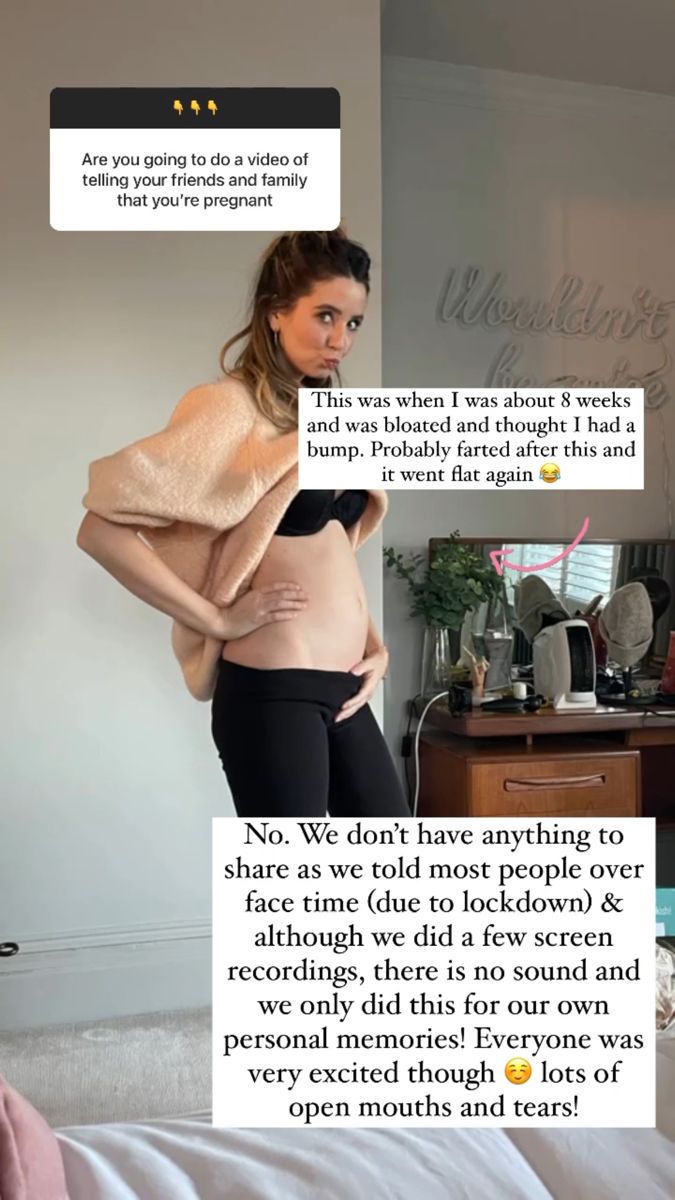 the pregnant woman is standing in her bed with an open shirt over her belly, and there are two texts above her