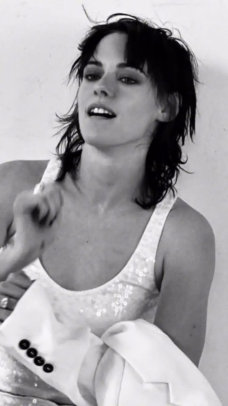 black and white photograph of a woman brushing her teeth