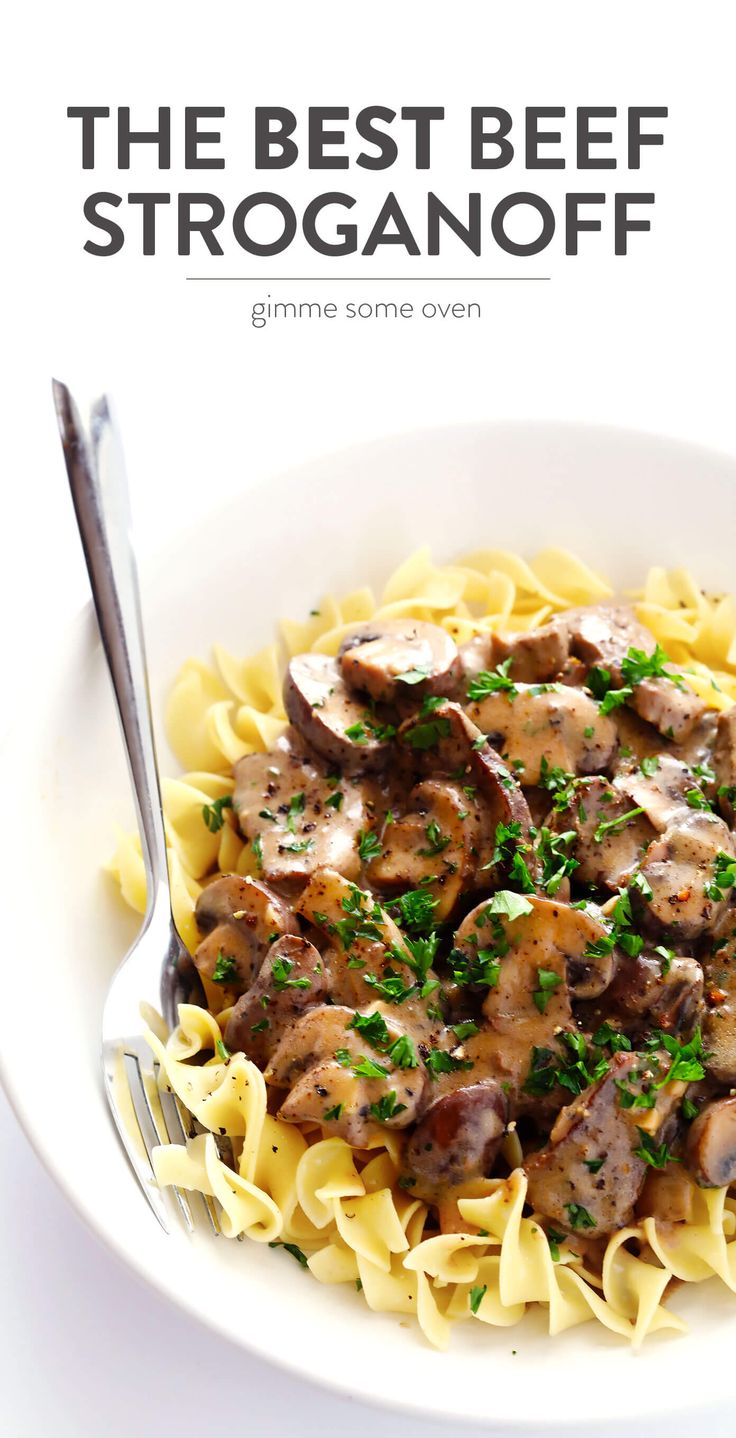 the best beef stroganoni is served in a white bowl with a fork