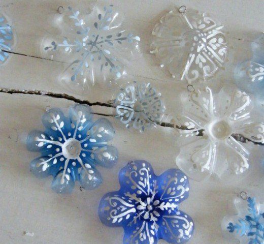 blue and white snowflakes are arranged on a table