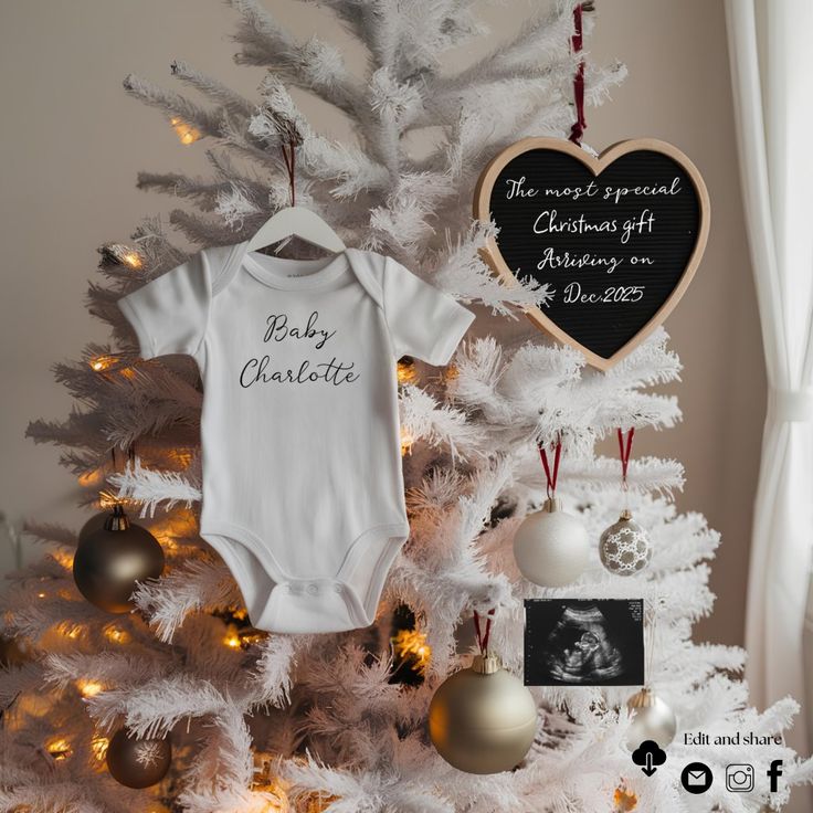 a baby's first christmas ornament is hanging on the top of a tree