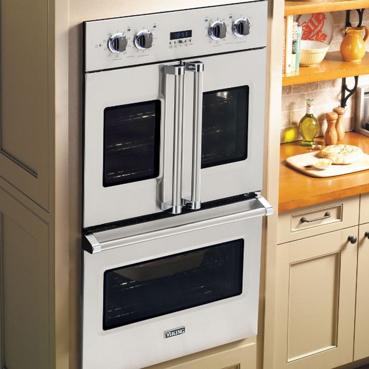 two ovens in a kitchen next to each other